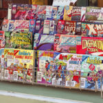 "Spokane, Washington, USA - August 25, 2012: Assortment of popular comic books for sale outside of a comic book shop in downtown Spokane, Washington."
